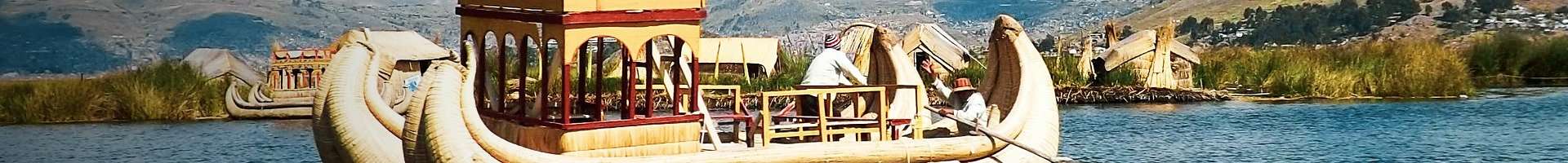 Traditional totora reed boat near the Uros floating islands, Lake Titicaca, Puno, Peru
